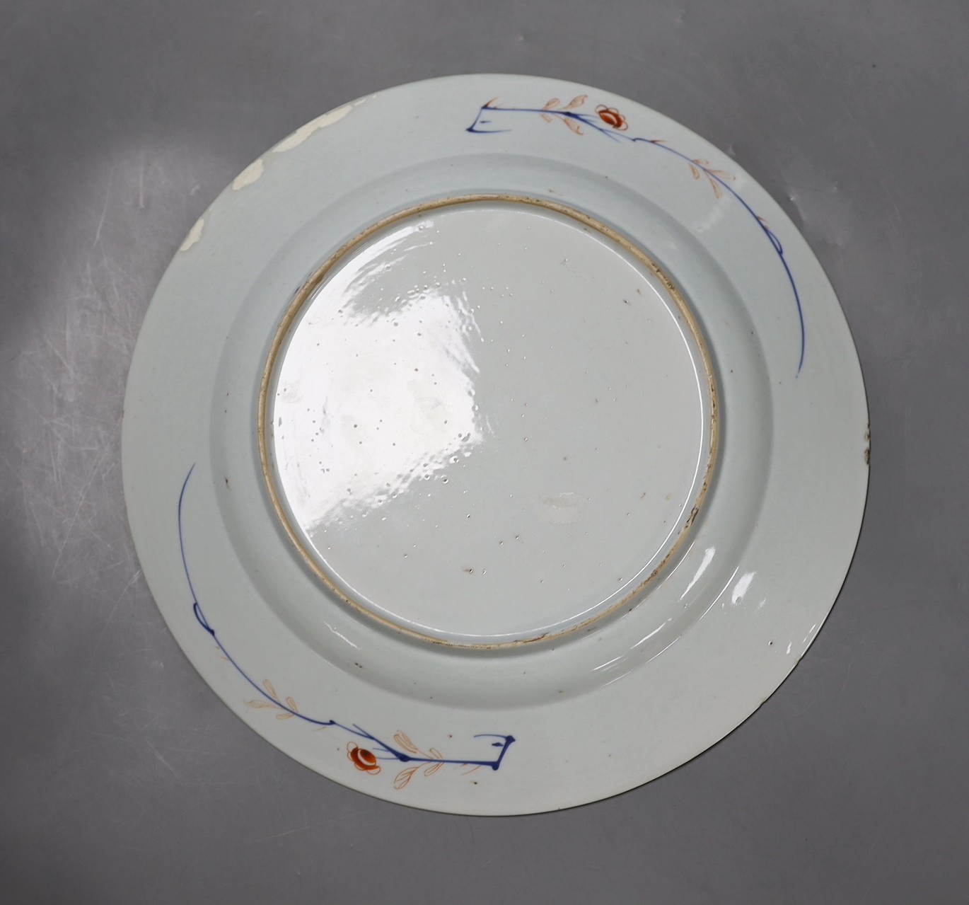 A Chinese blue and white octagonal plate with botanical decoration, together with another Chinese Imari plate with landscape decoration, 31cm diameter